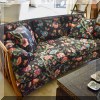 F01. Mid Century curved settee with chintz upholstery. 27”h x 65”w x 33”d 